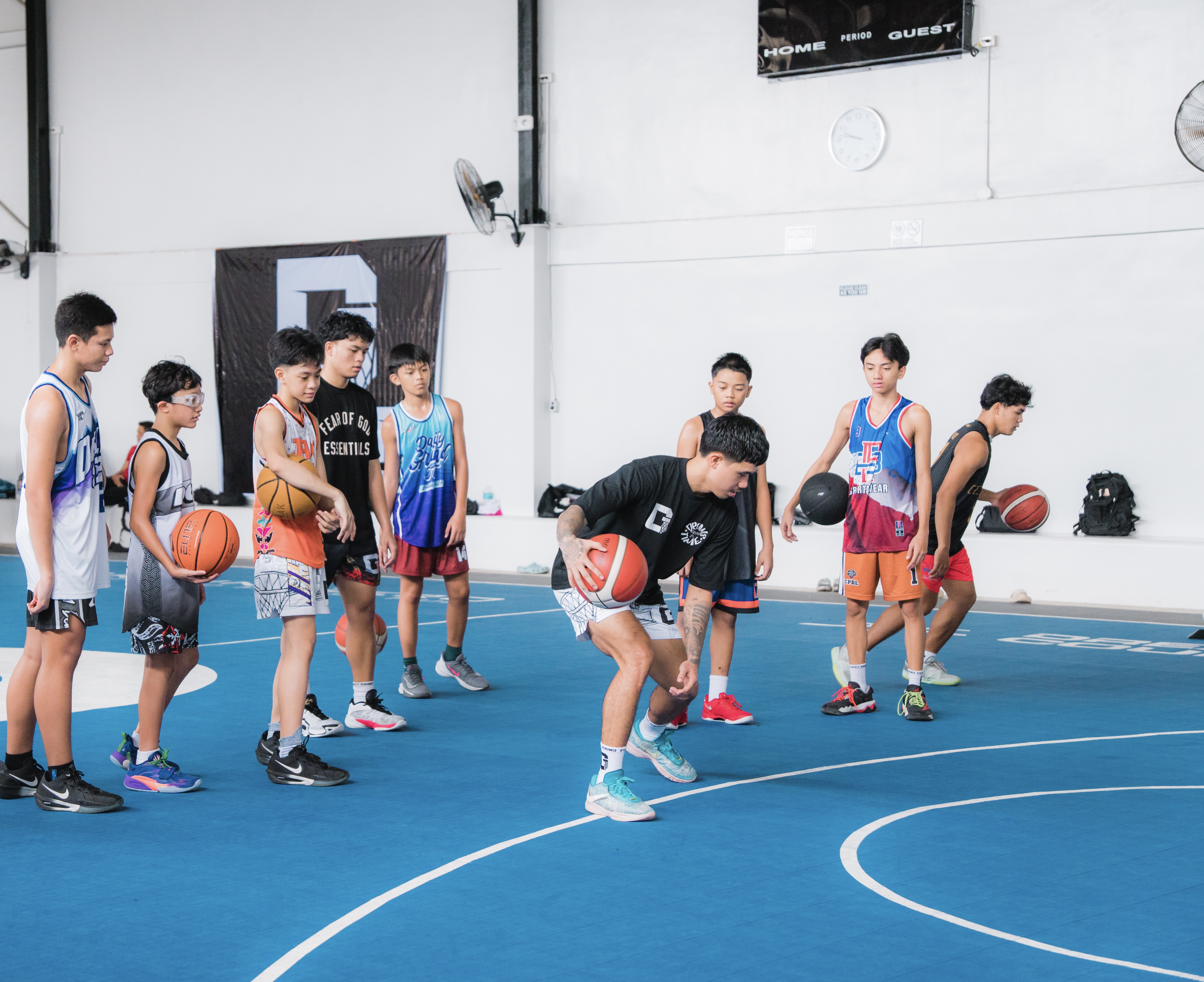 Coach Tommy leading a DGIT group basketball training session